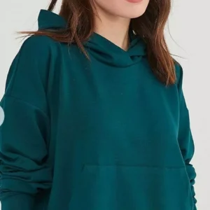 A modern, oversized women's hoodie with a clean, minimalist design.