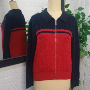 zip-up sweater/cardigan featuring a cable-knit pattern on the body.