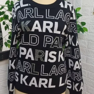 KARL Lagerfeld Paris knit sweater featuring a bold, all-over logo design
