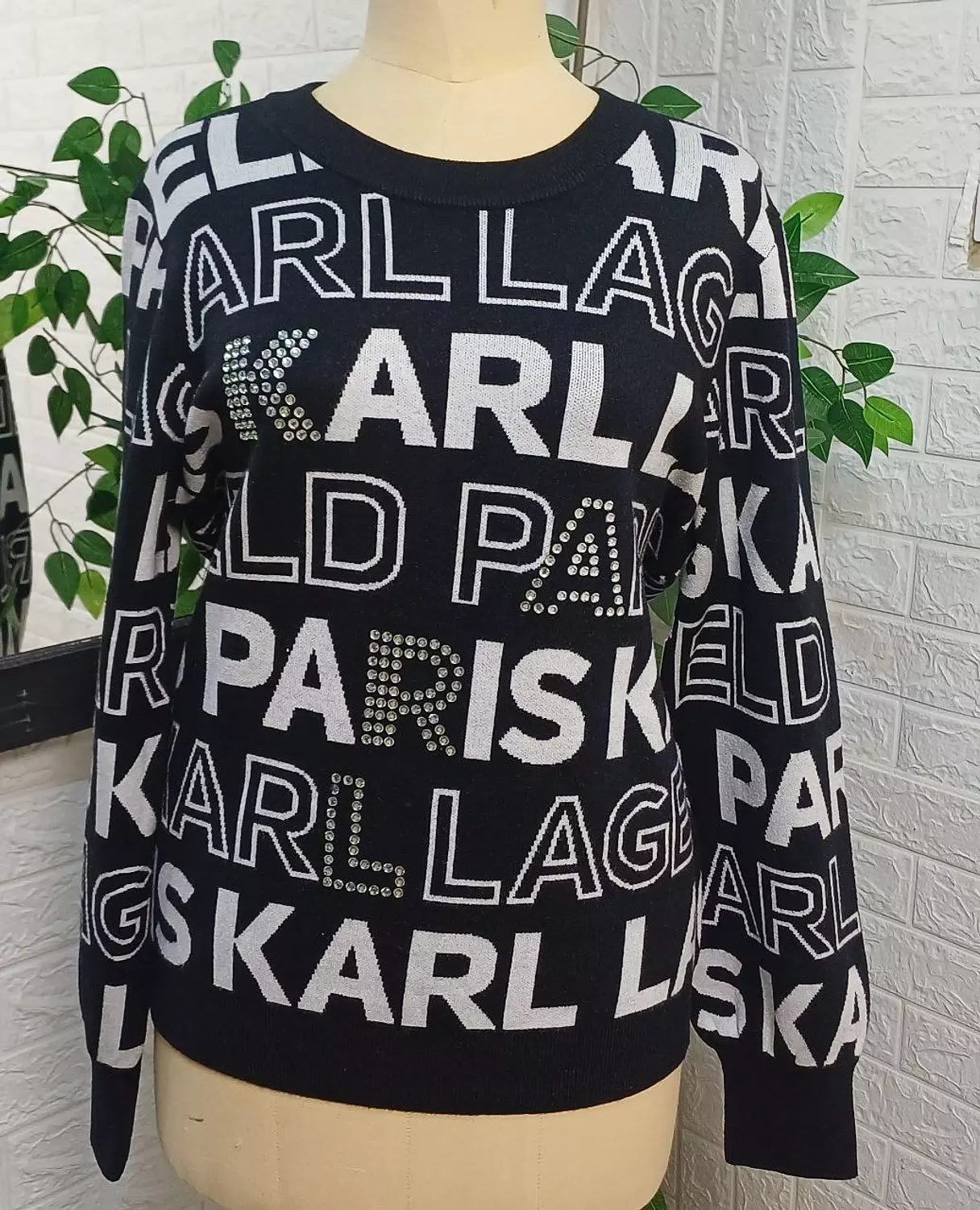KARL Lagerfeld Paris knit sweater featuring a bold, all-over logo design