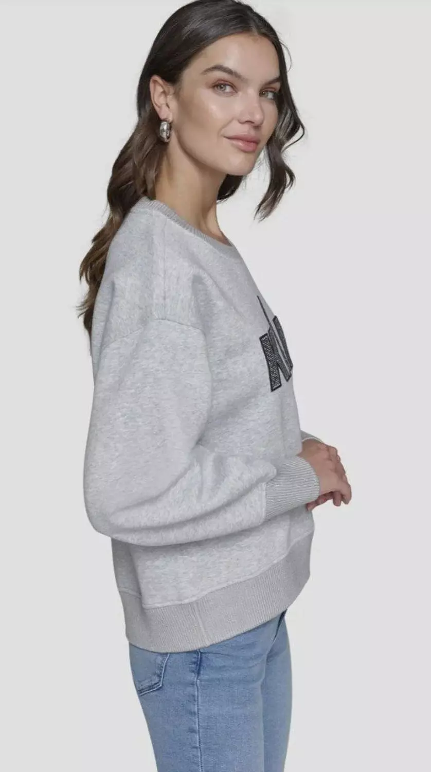 KARL Lagerfeld Paris sweatshirt that blends Parisian heritage with modern sparkle
